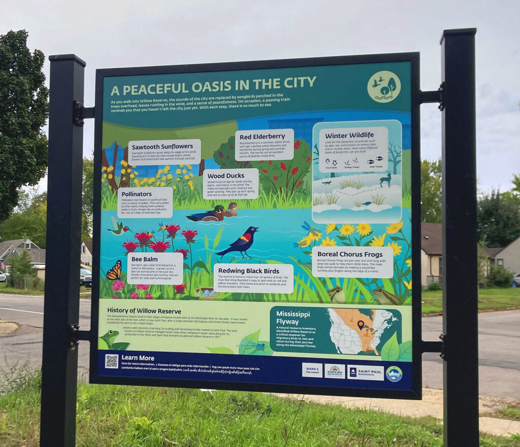 Sign with illustration highlighting plants and wildlife that visitors can find in Willow Reserve
